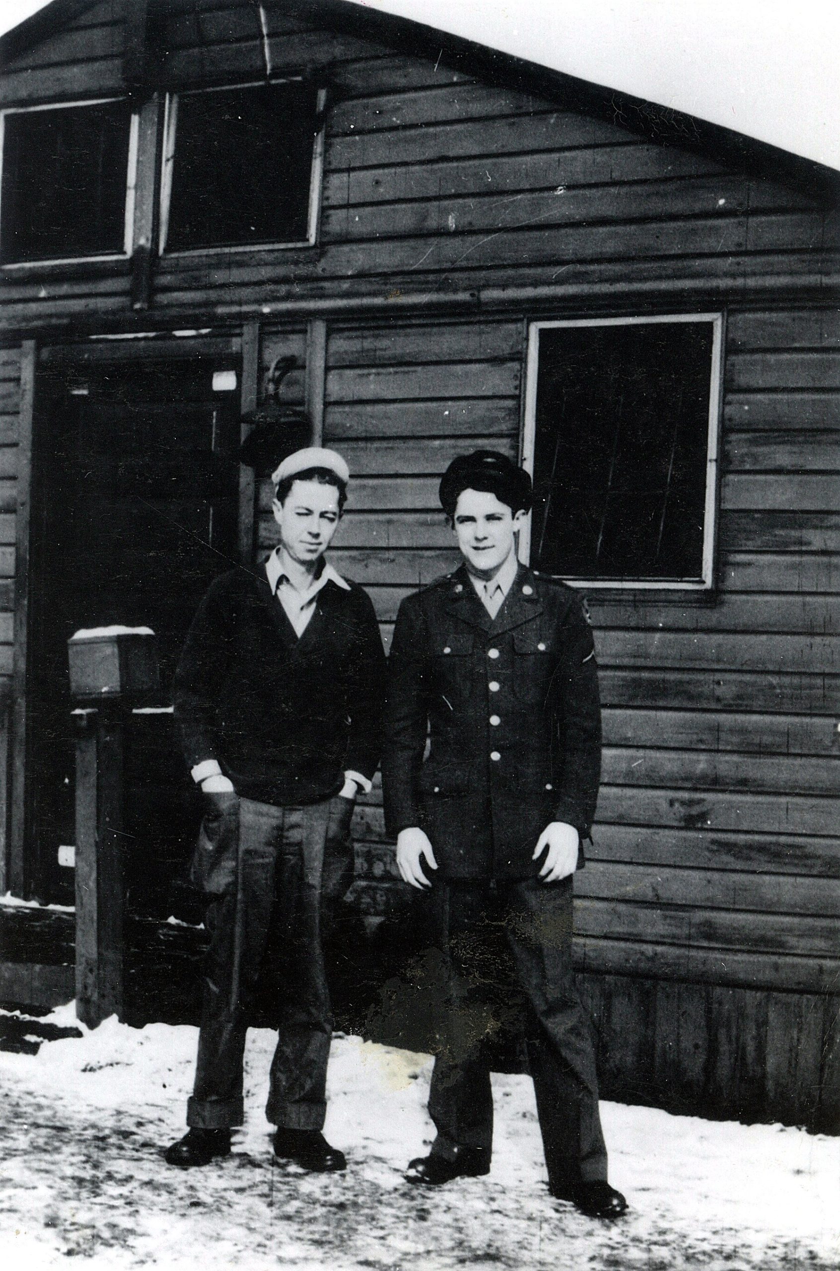 The founder's father, in uniform, with a friend outside a barracks during World War II